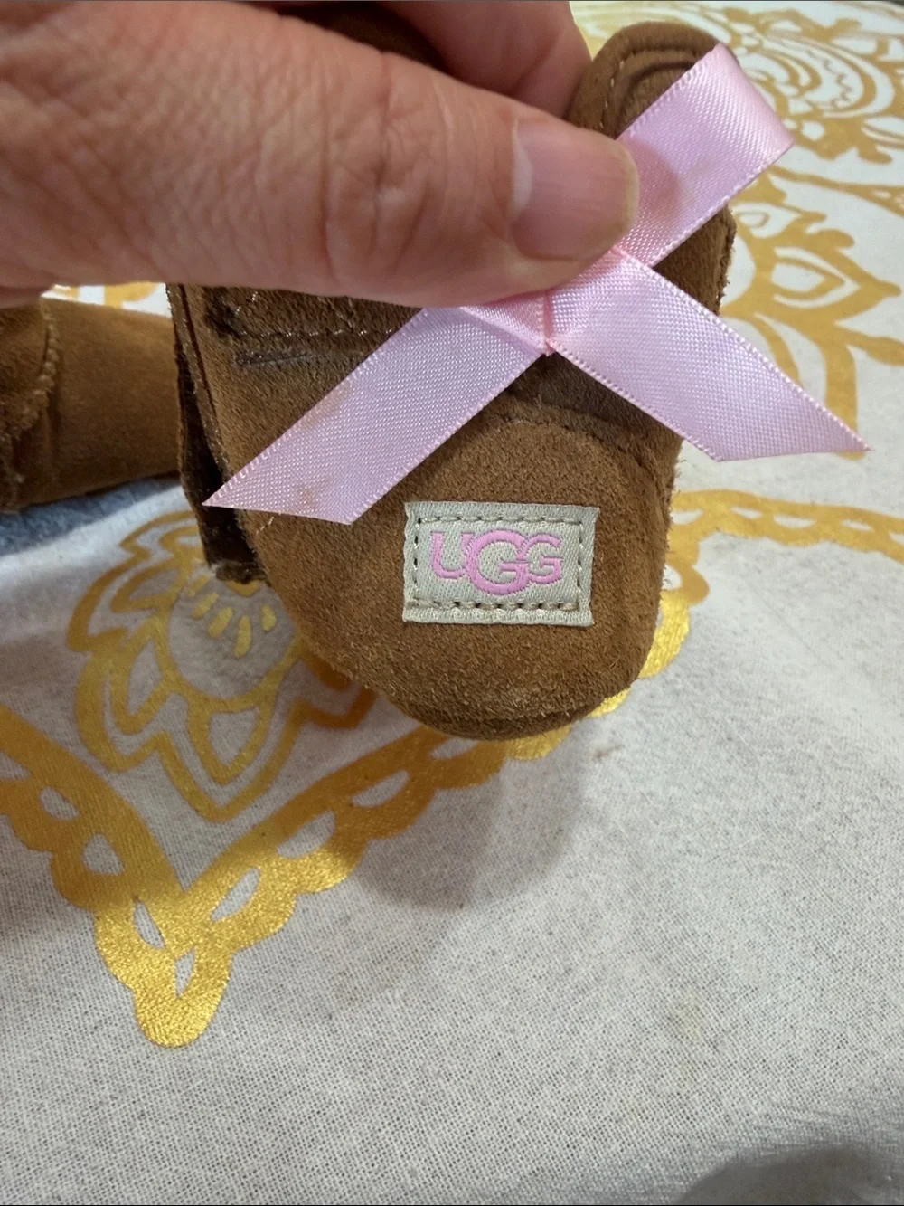 UGG Kids Brown Shearling Boots with Pink Ribbon